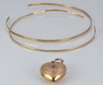 Two 9ct gold bangles 5.1g and a 9ct gold back and front heart locket