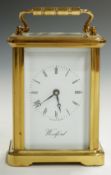 Woodford brass carriage clock c1980, the enamelled Roman dial with Breguet style hands, in brass