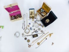 A collection of costume jewellery including a 9ct gold cross, watches, badges, Victorian brooch,