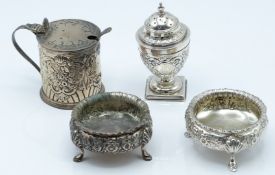 Pair of Victorian hallmarked silver open salts with embossed decoration, raised on three hoof