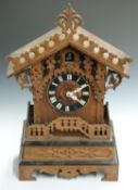 Late 19thC/ early 20thC Black Forest mantel cuckoo clock with pierced gallery decoration and two