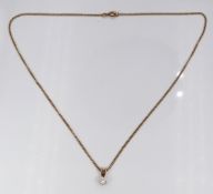 A 9ct gold necklace and pendant set with a single diamond of approximately 0.25ct, 3.6g