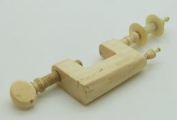 A 19thC ivory sewing / needlework clamp, height 12cm with cotton spool