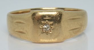 A 9ct gold ring set with a diamond in a star setting, 3.7g, size R/S