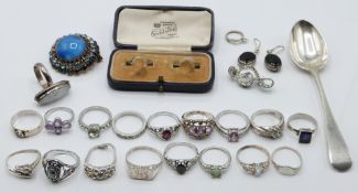 A collection of silver jewellery including 12 silver rings, silver spoon and Kendal & Dent