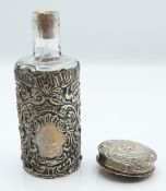 Small hallmarked silver trinket box with embossed decoration of a girl on a swing, diameter 3.5cm,