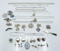 A collection of silver jewellery including enamel pendant, Edwardian silver swallow brooch,