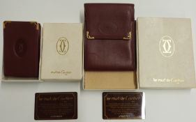 Le Must de Cartier leather wallet and a matching cigarette box holder, in original boxes