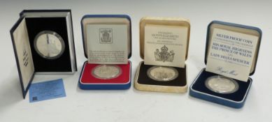 Four cased commemorative silver proof crowns comprising Royal Mint 1977 Silver Jubilee, 1980 Queen