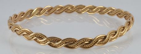 A 9ct gold plaited bangle, 10.4g