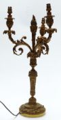 Early 20thC gilt metal three branch candelabra with cast floral and foliate decoration, height 51cm