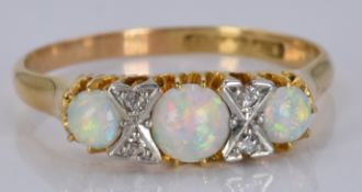 An 18ct gold ring set with opals and diamonds, 3.5g, size R