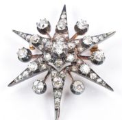 Victorian metamorphic star pendant/ brooch set with old cut diamonds, the largest approximately 0.