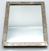 White metal framed easel backed mirror with scrolling engraved decoration, impressed Sterling, IND