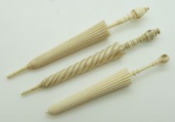 Three 19thC ivory and bone stanhope parasol needle cases comprising 'Souvenir des Invalides',
