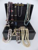 A collection of necklaces including pearls, amethyst etc, in Asprey jewellery box