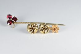A pair of yellow metal knot earrings, a yellow metal earring (1.6g) and a Victorian stick pin set