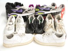 Eight pairs of Nike trainers including Air Force-1 (UK 7), black Air Max (UK 5),  purple, green,