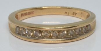A 9ct gold half eternity ring set with diamonds, 2.4g, size L/M