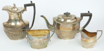 George V hallmarked silver four piece teaset with reeded lower bodies, Sheffield 1909/1910/1911