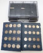 A collection of UK silver coinage in an album, William IV sixpence, Queen Victoria godless florin,