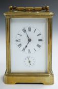 WITHDRAWN     A 19th or early 20thC brass cased repeating carriage clock, the white enamel dial with
