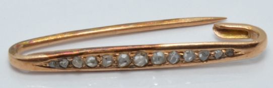 A 9ct gold brooch set with rose cut diamonds, length 4cm, 1.4g