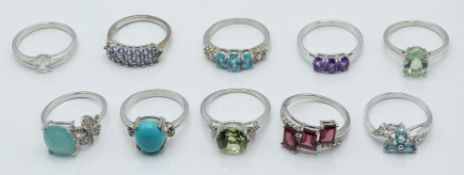 Ten silver rings set with amethyst, tanzanite, turquoise and blue diamond, zircon, aquaprase,
