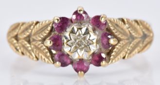 A 9ct gold ring set with a diamond and a rubies, 2.9g, size P/Q