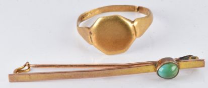 An 18ct gold signet ring (3.1g) and a 9ct gold brooch set with a turquoise cabochon (1.7g)