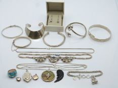 A collection of silver jewellery including five bangles, three silver lockets, necklaces, ring etc