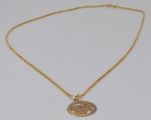 A 9ct gold Taurus pendant and chain, 3.5g