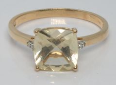 A 10k gold ring set with seranite and diamonds, size U