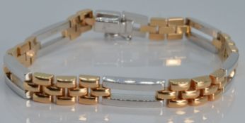 An 18ct bi-coloured gold bracelet made up of rectangular links, 17.8g