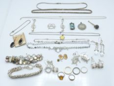 A collection of silver jewellery including silver chains, bracelet, earrings, enamel St Christopher,