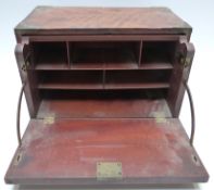 A 19thC brass-bound mahogany veneer campaign stationery box or travelling desk with secretaire
