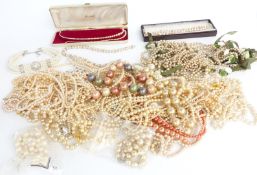 A collection of faux pearls and a faux peal necklace