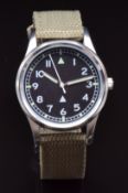 British RAF military style wristwatch with luminous hands and hour markers, white Arabic numerals,