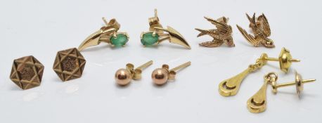 Five pairs of 9ct gold earrings including emerald set and a pair in the form of swallows, 4.5g