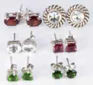 Six pairs of silver earrings set with tourmaline, garnet, aquamarine, etc