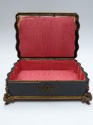 A 19thC wooden jewellery box inlaid with mother of pearl, blue lacquer and brass, set with a painted