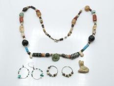 An antique beaded necklace, earrings and pendant including Persian, Syrian, Egyptian etc, around