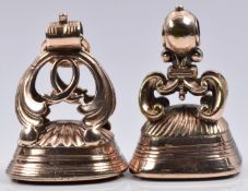 Two Victorian seals, one set with chalcedony agate and one carnelian agate, with scrolling detail to
