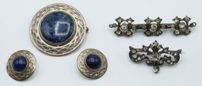 Celtic silver brooch set with sodalite, a pair of matching earrings and two white metal