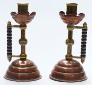 Pair of Christopher Dresser, Arts and Crafts copper and brass candlesticks, height 19cm
