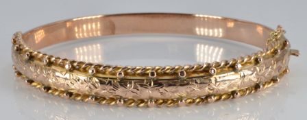 Edwardian 9ct gold bangle with rope twist and engraved foliate decoration, Birmingham 1904, 10.7g