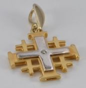 A bi-coloured gold cross pendant set with a diamond, 4.4g