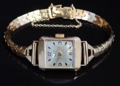 Universal Geneve 18ct gold ladies wristwatch with gold hands, Arabic numerals and hour markers,