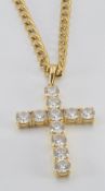 A 9ct gold necklace/ chain, (3.6g) and a 14k gold cross set with cubic zirconia, (4.8g)