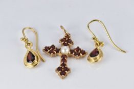 A 9ct gold cross pendant set with a pearl and garnets and a pair of yellow metal earrings set with a